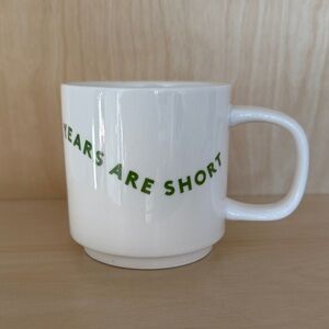 Lovevery White Ceramic Mug with Green Text